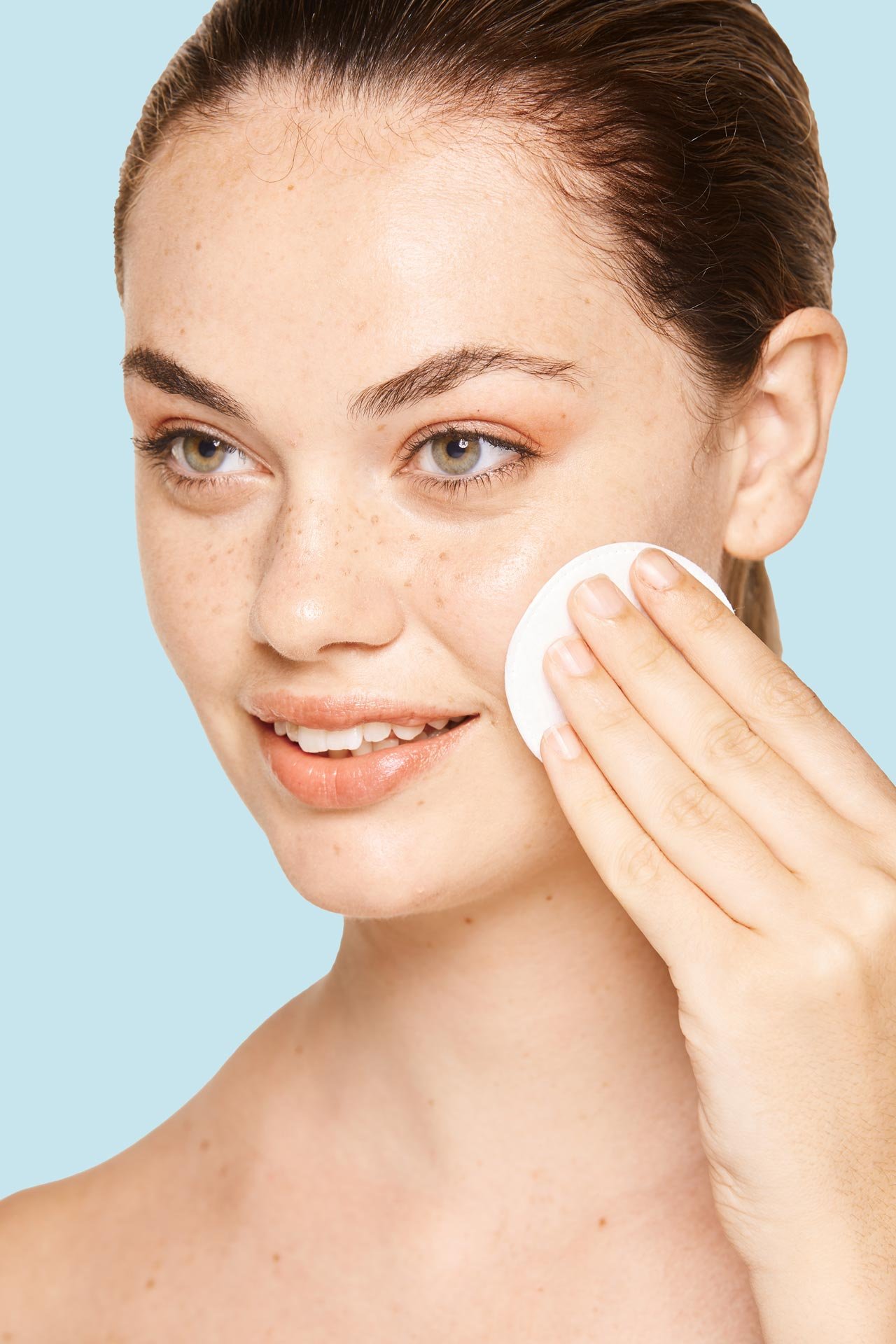 peaceful-female-applying-toner-on-radiant-face-wit-2022-03-04-05-43-08-utc.jpg